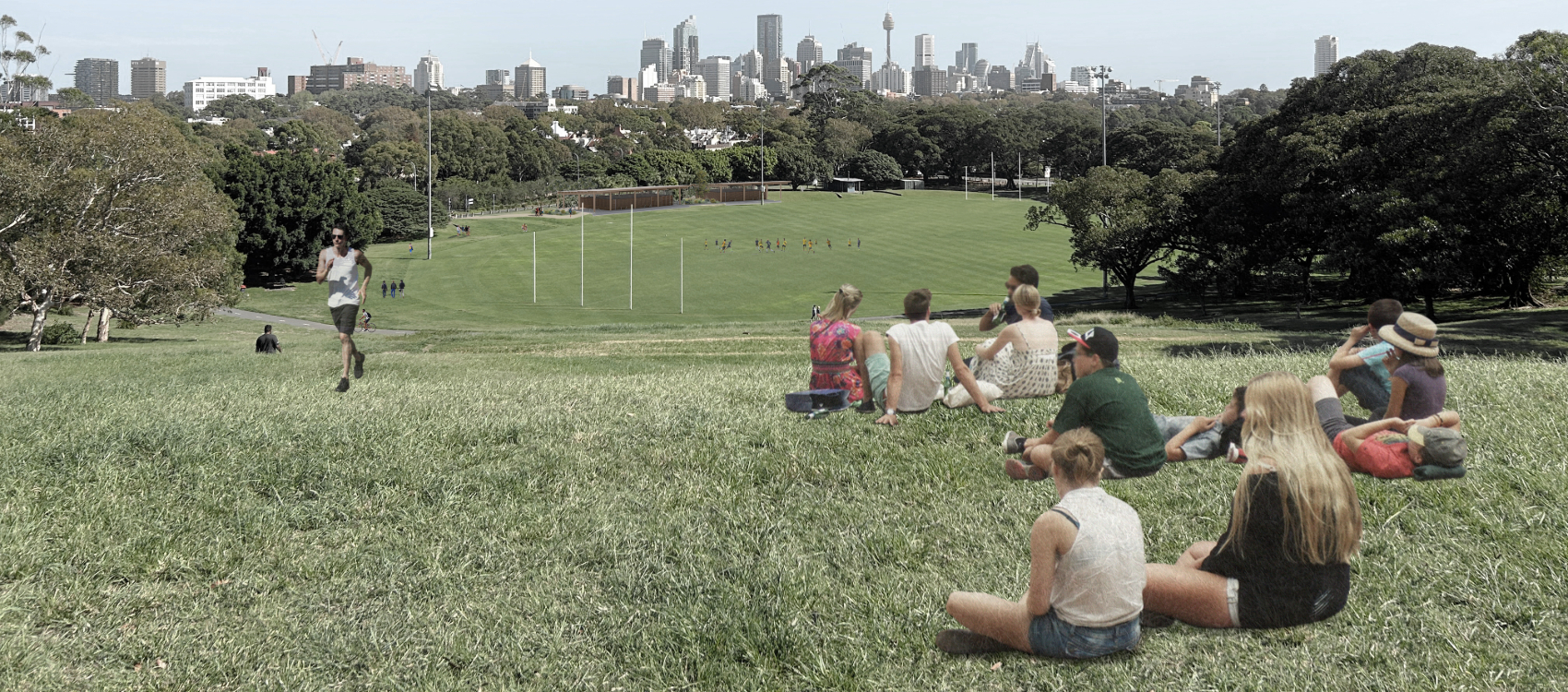 A group of people sitting on top of a hill 